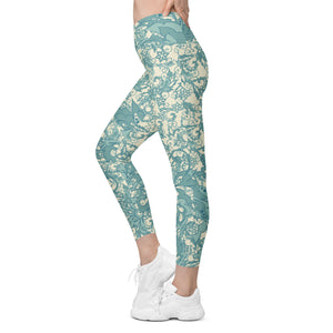 Teal Flowers and Swirls on Cream Crossover leggings with pockets