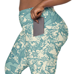 Teal Flowers and Swirls on Cream Crossover leggings with pockets